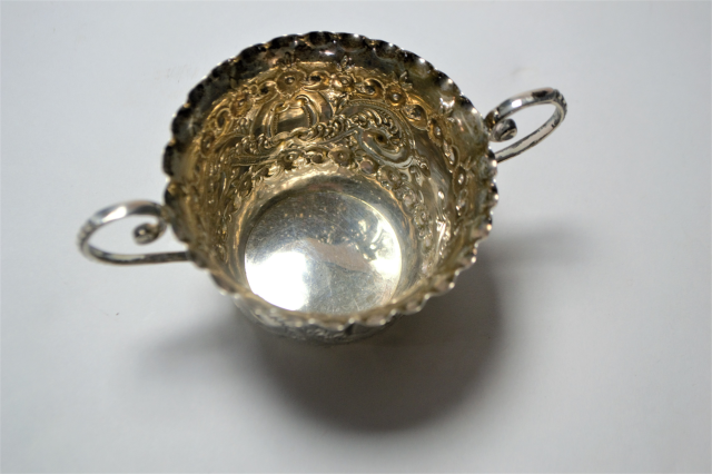 A Silver Two Handled Loving Cup With Repousse Decoration.