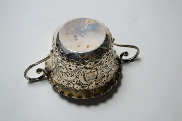 A Silver Two Handled Loving Cup With Repousse Decoration.
