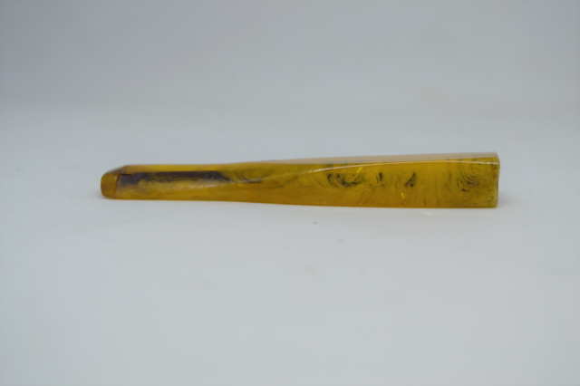 A Tortoise Shell Cigarette Holder.