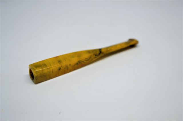 A Tortoise Shell Cigarette Holder.