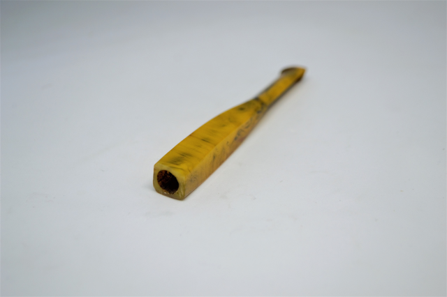 A Tortoise Shell Cigarette Holder.