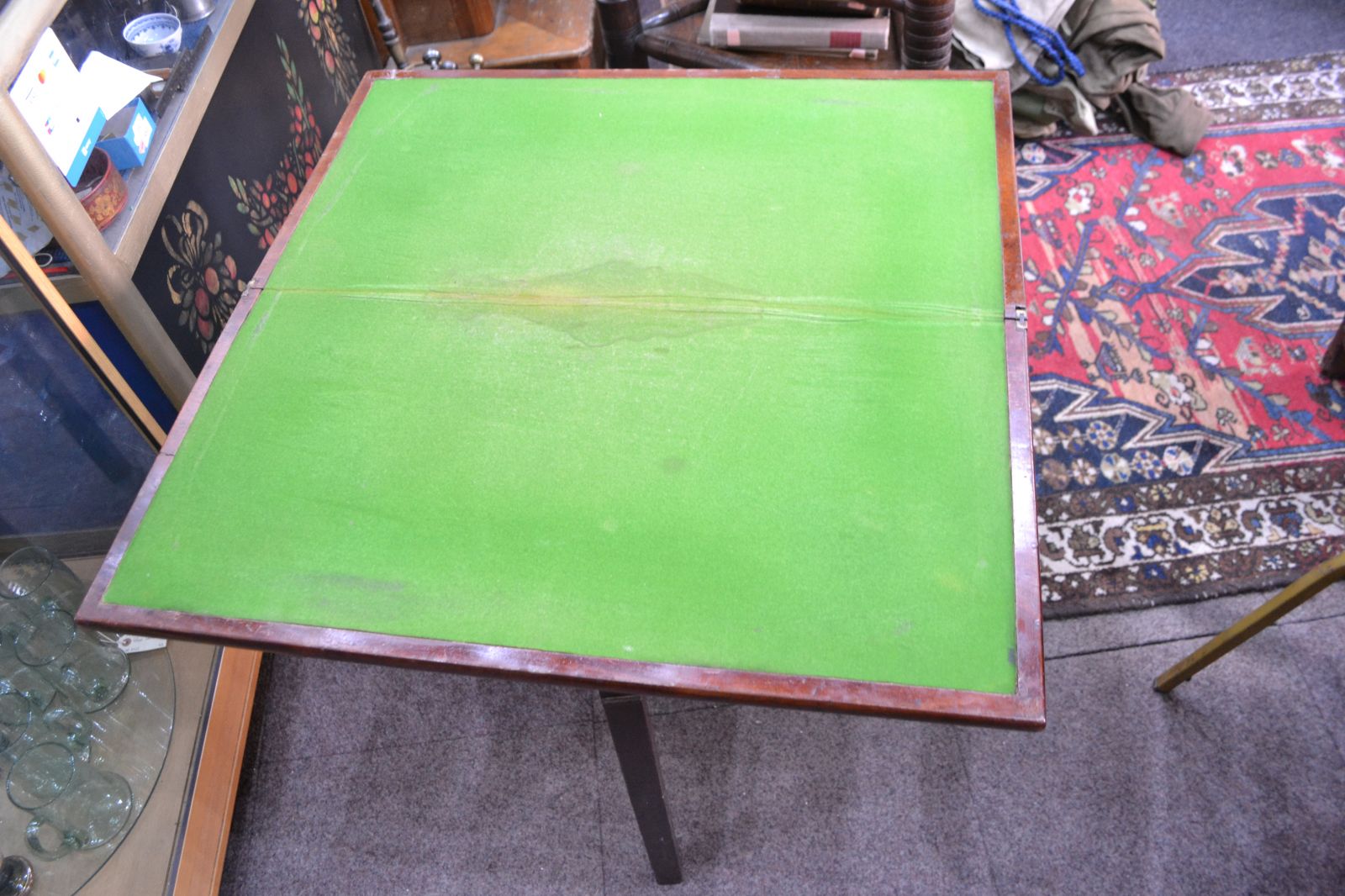 Discover our George III Mahogany card table. Despite wear on its green cover, it remains in reasonable condition. Shop now for vintage furniture delights!