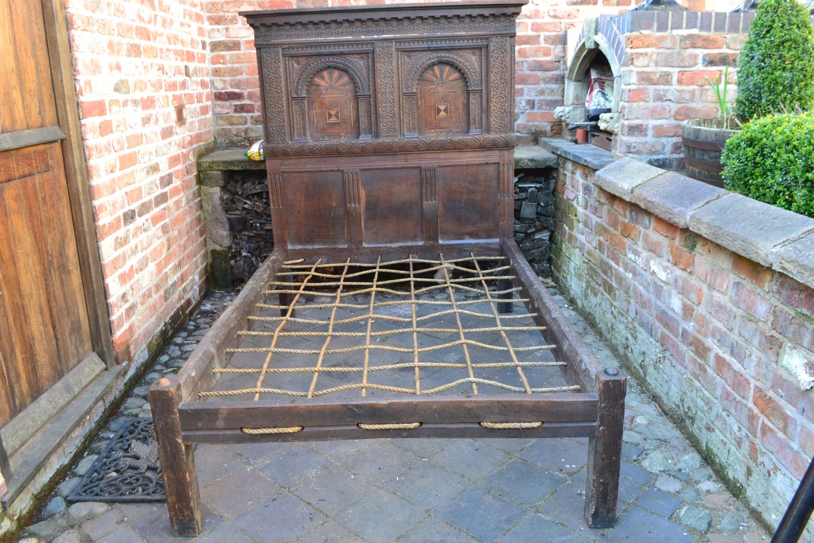 17th Century Oak Frame Bed with sides and carved head board.
