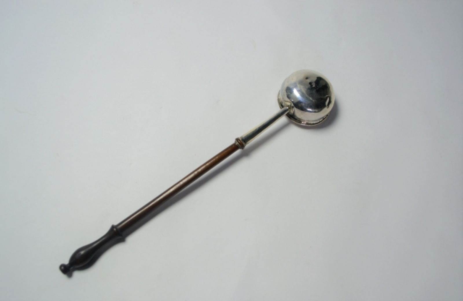 An 18th c. Silver Toddy Ladle With Wooden Handle.