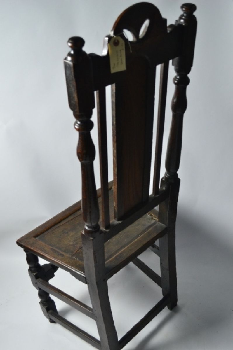 Discover our 17th-century oak back stool, circa 1680. Though complete, it features some later repairs. Explore the exquisite craftsmanship now!