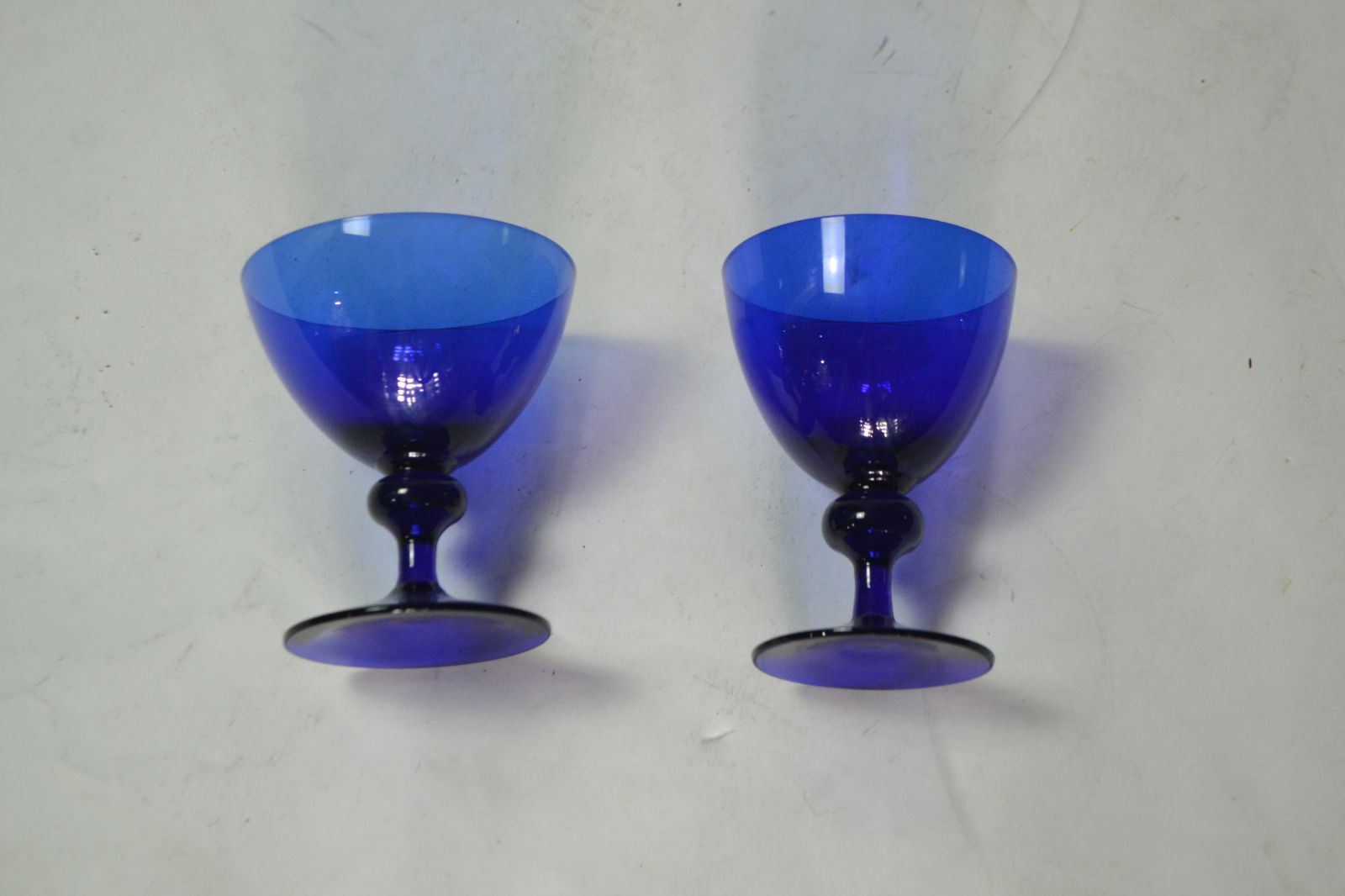 Discover our rare pair of 19th Century Bristol Blue drinking glasses. A perfect addition to any collection. Shop now to secure these unique pieces!

