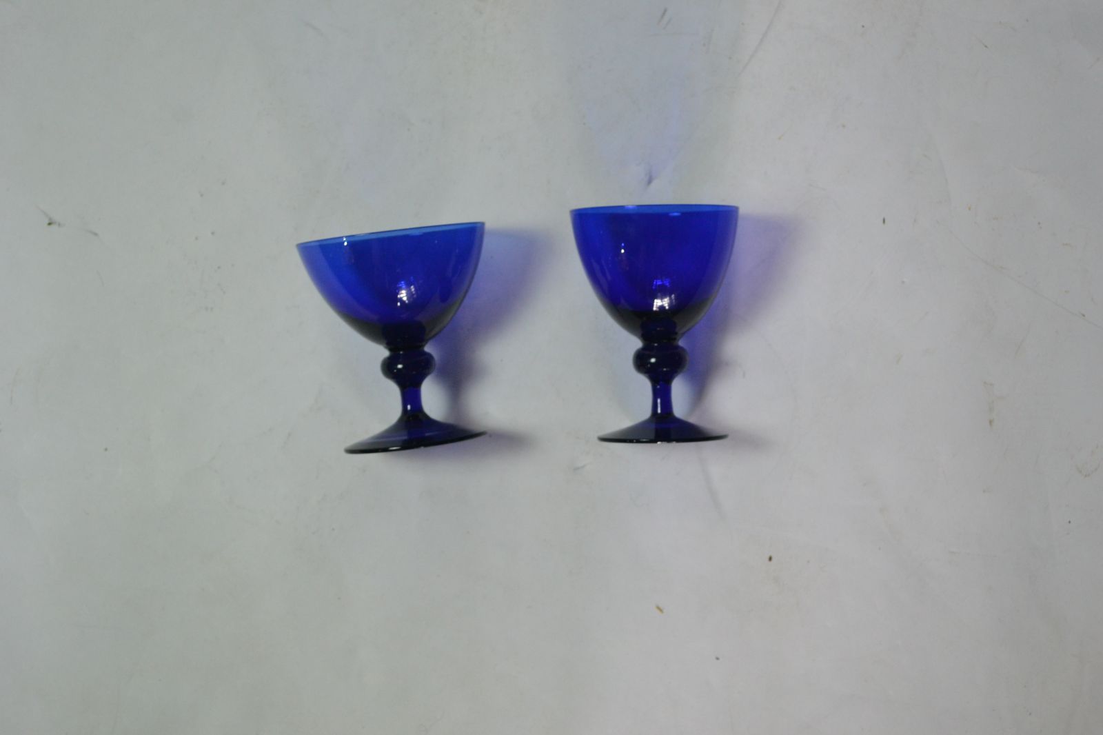 Discover our rare pair of 19th Century Bristol Blue drinking glasses. A perfect addition to any collection. Shop now to secure these unique pieces!

